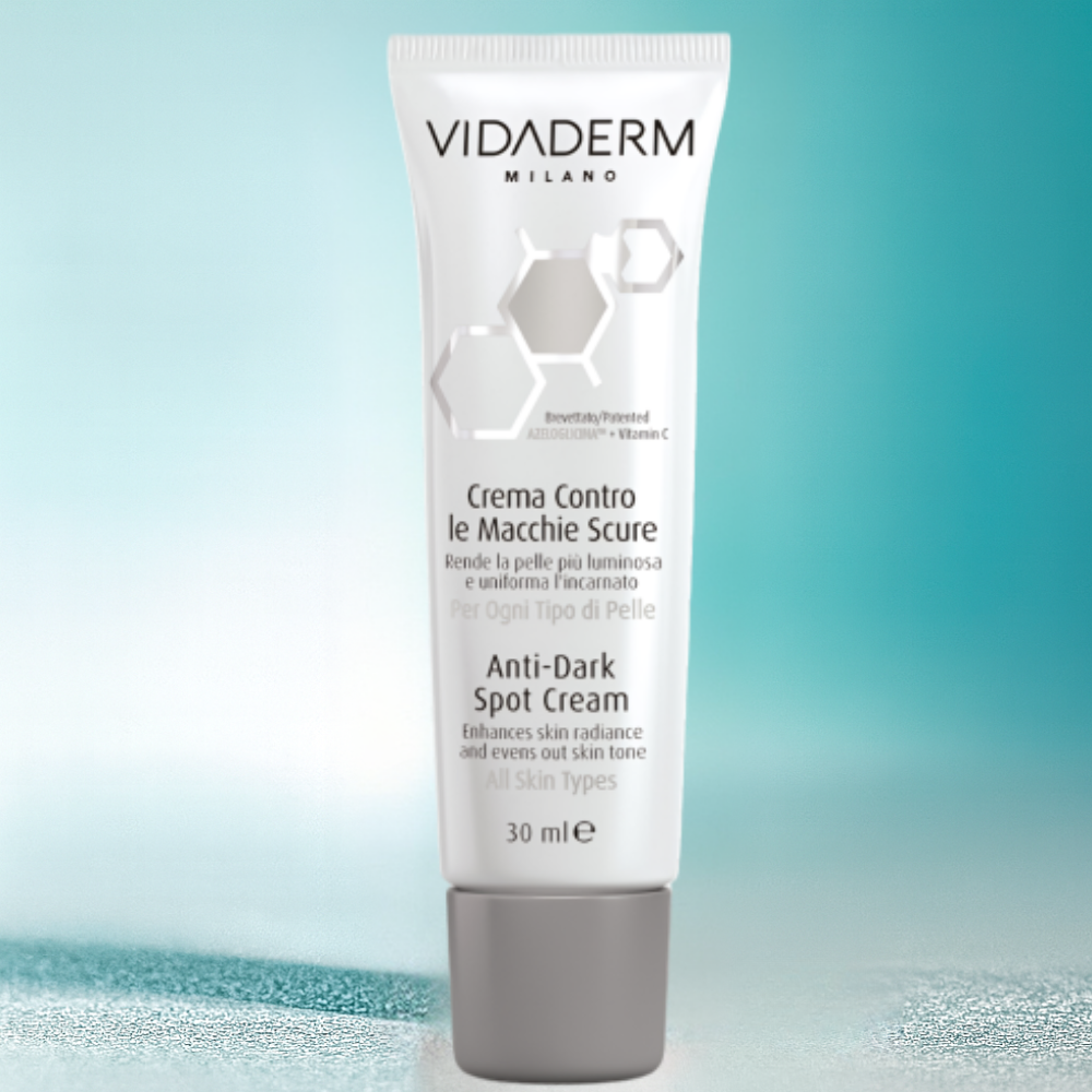 Vidaderm Anti-Dark Spot Cream tube on a gradient blue background